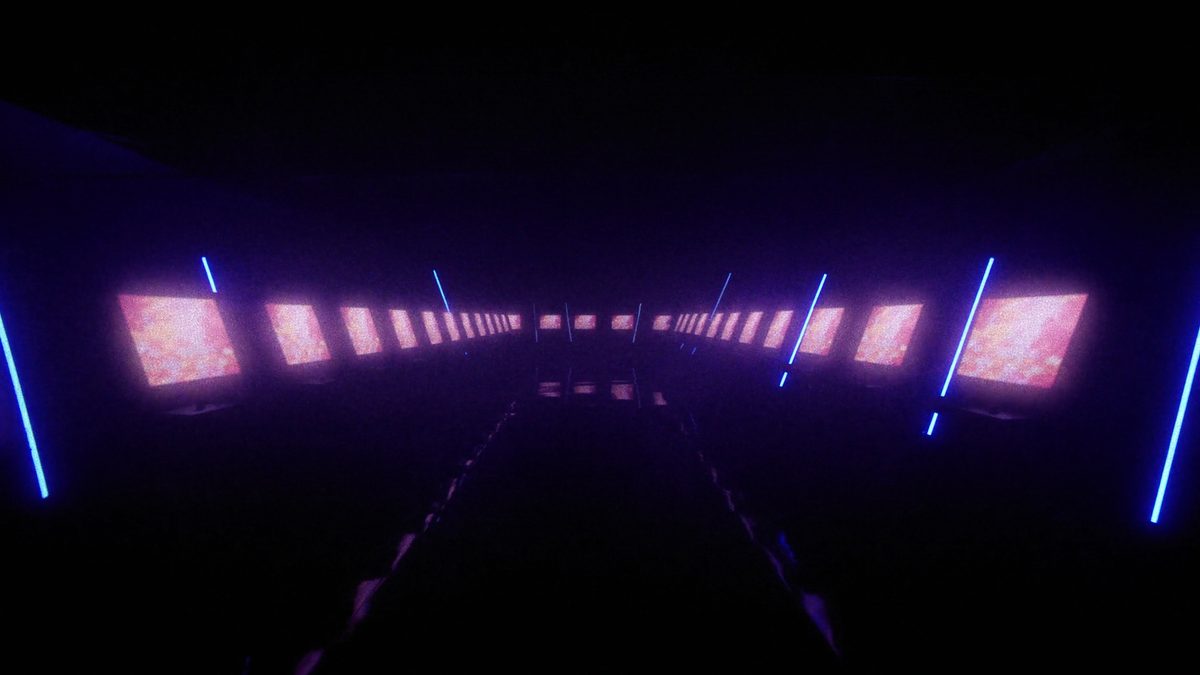 Dark arcade hall with glowing cabinets